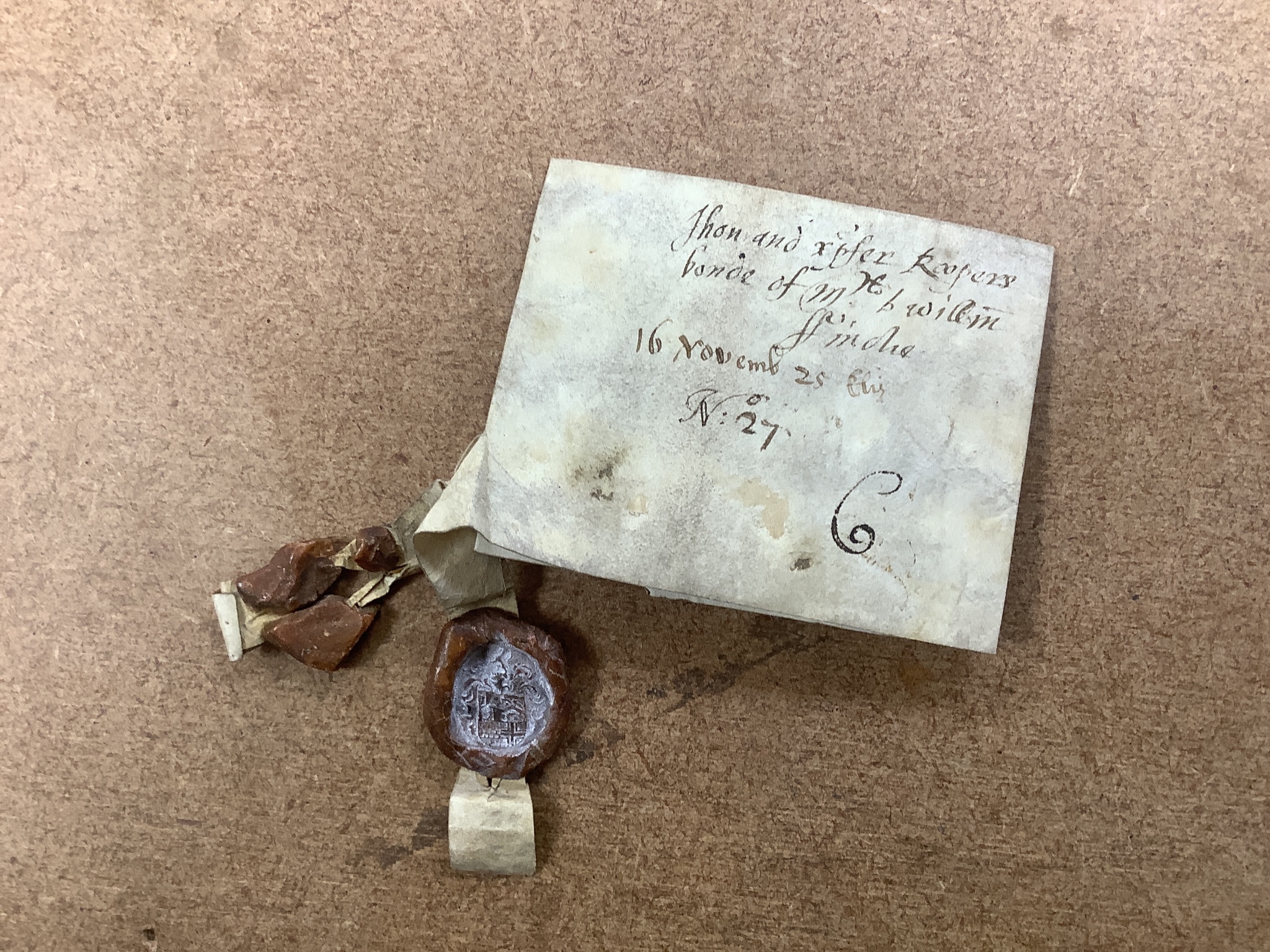 A group of coins, medals including a cartwheel twopence 1797 and an Elizabethan vellum deed